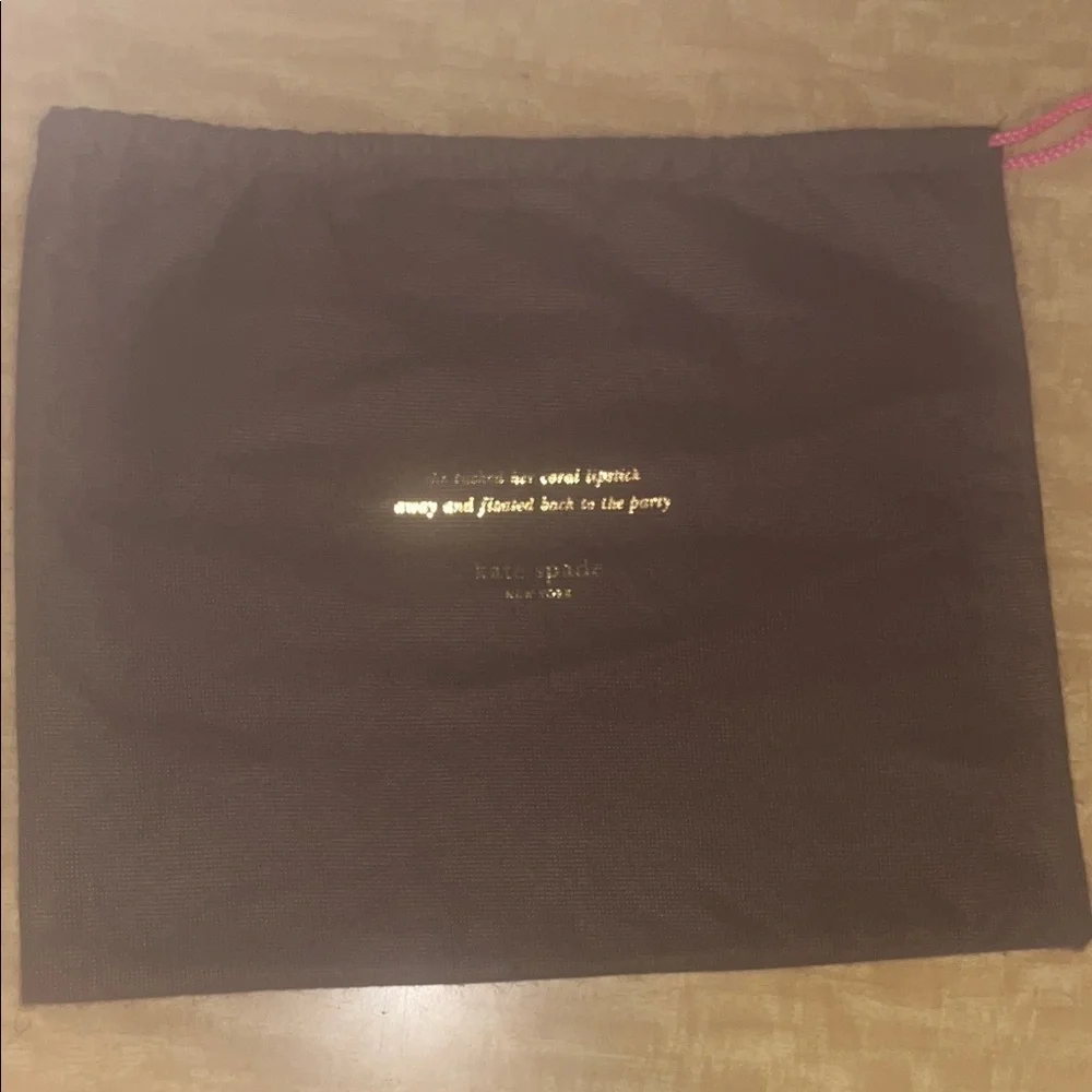 Kate Spade Brown Pouch with Gold Text Medium sized.